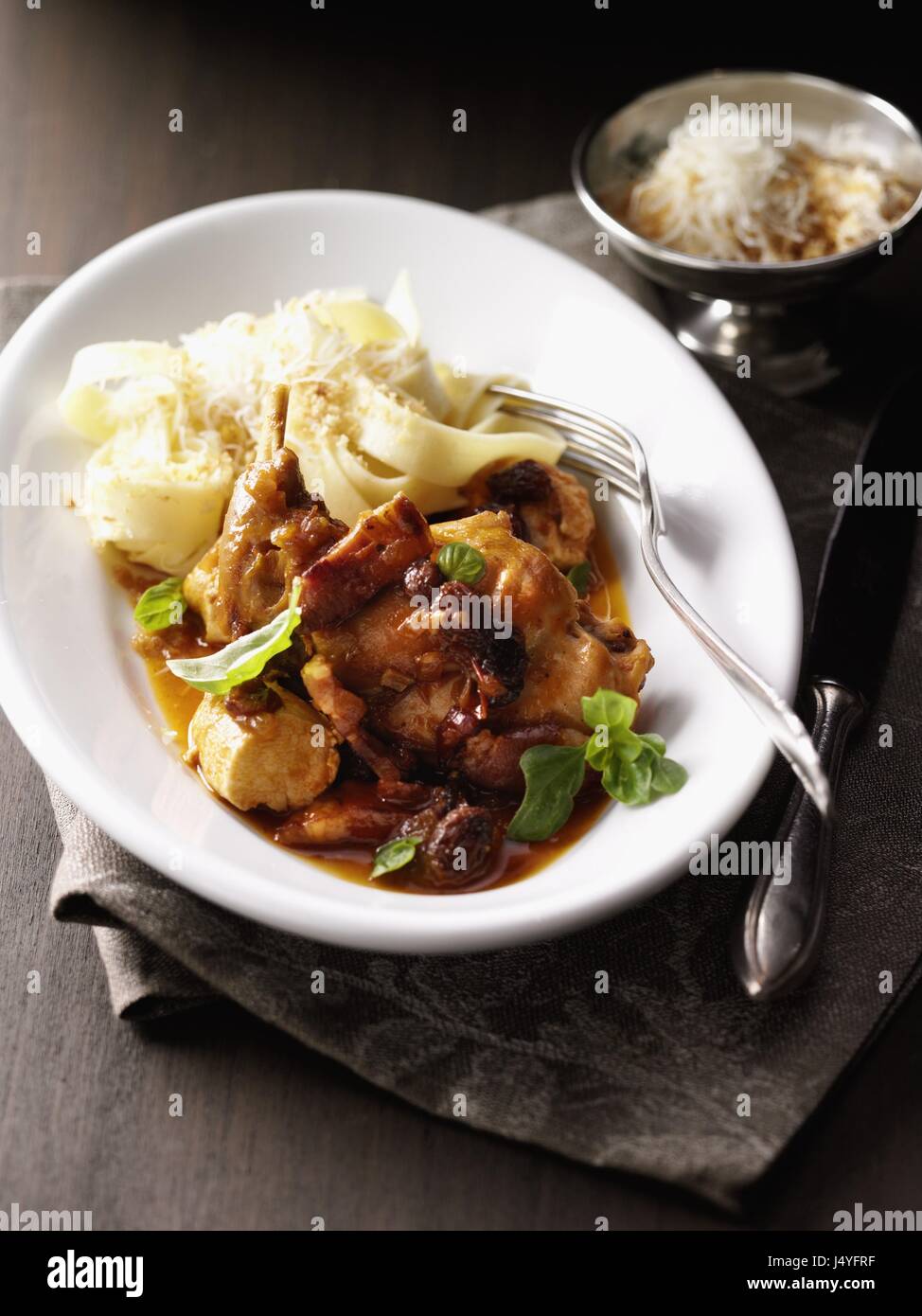Rabbit in tomato sauce with pork belly Stock Photo Alamy