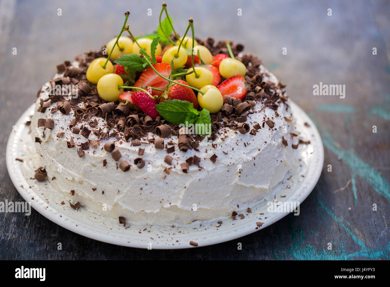 chocolate cake with strawberry and yellow cherry Stock Photo - Alamy