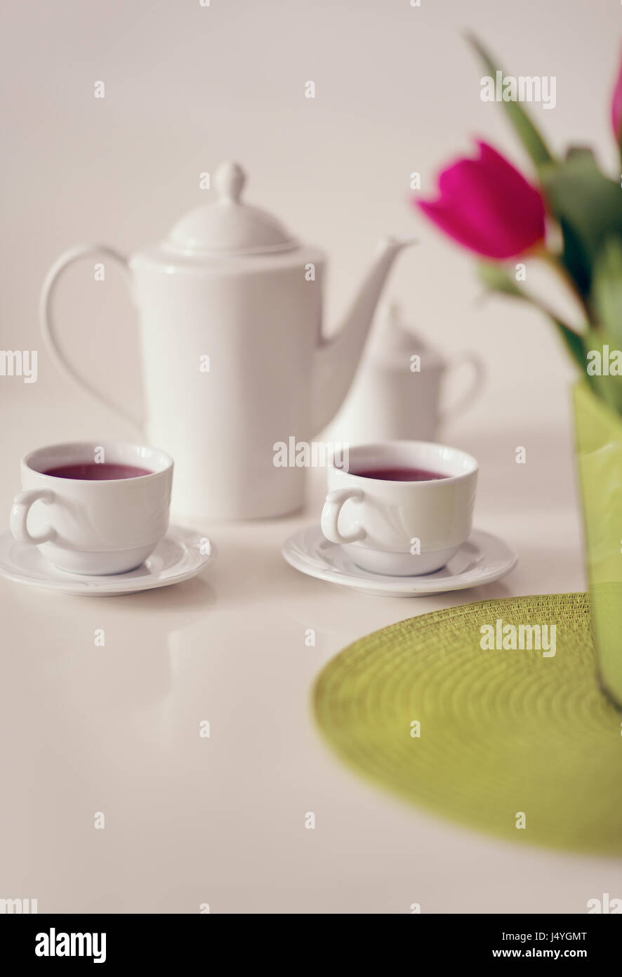 Beautiful white porcelain tea service on table Stock Photo