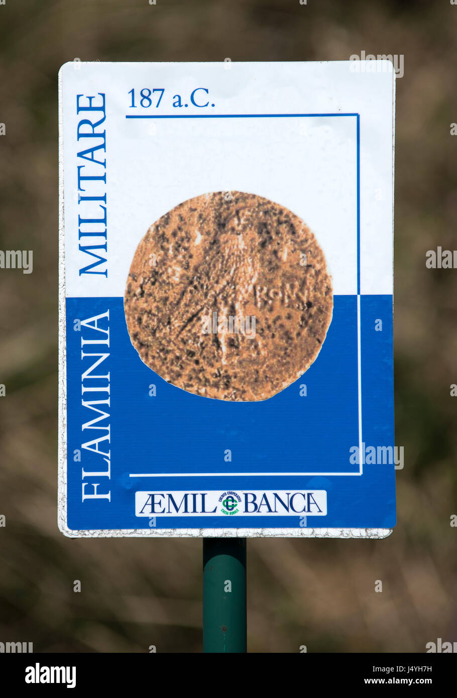 The signboard that is pointing to the path of the Flamiania Militare or Way of the Gods, which remembers the Roman coin found as the first indication of the find of the road. Stock Photo