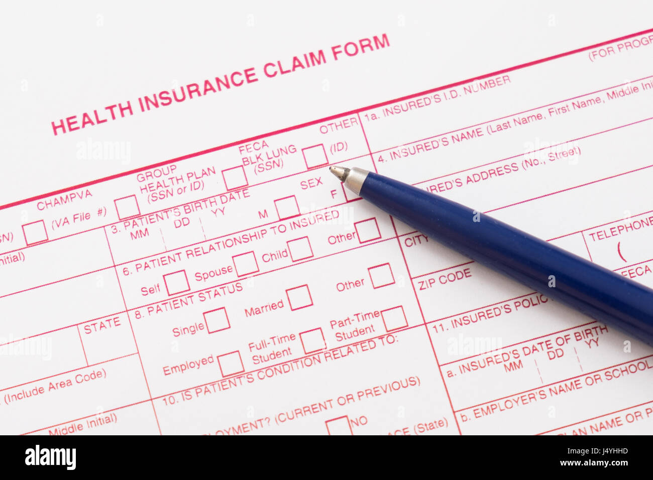Health insurance claim form with pen and glasses Stock Photo Alamy