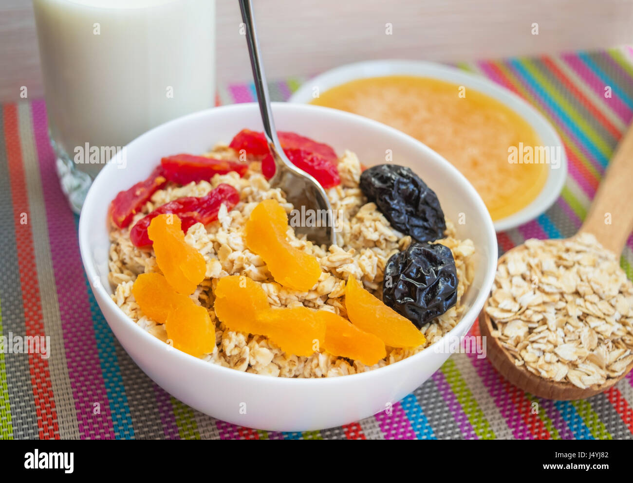 Oatmeal with dried fruit (apricots, dogwood, prunes), with honey and