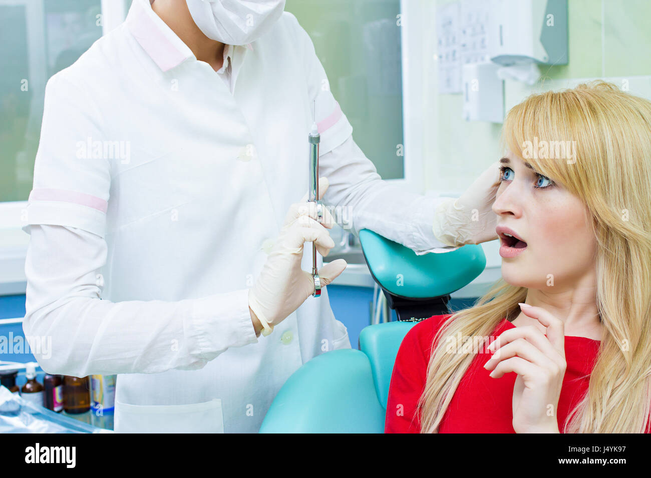 Closeup portrait terrified girl woman scared of needles, syringes