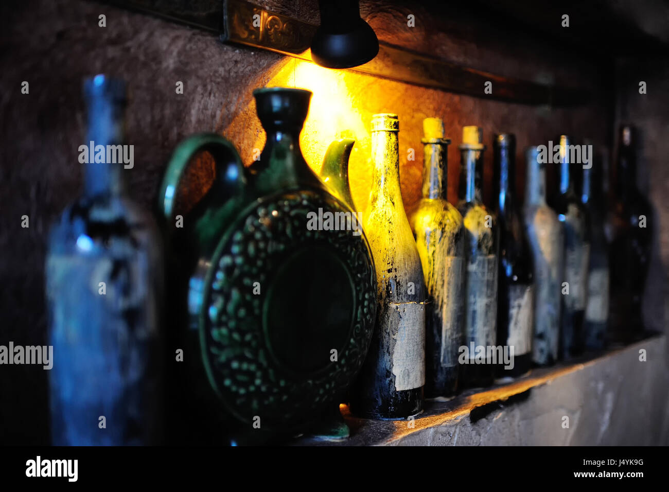 Bottles with old wine in a cellar Stock Photo Alamy