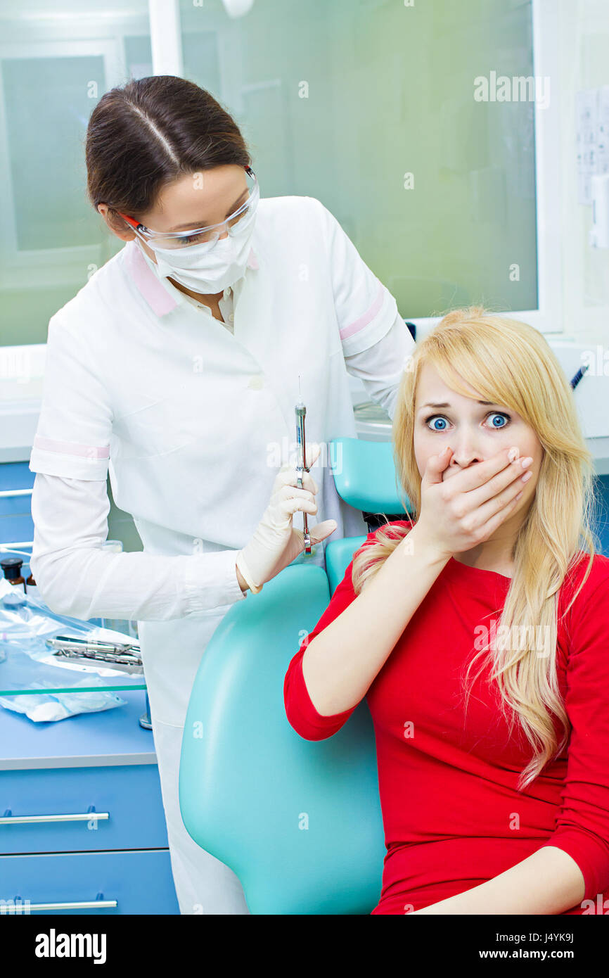 Closeup portrait terrified girl woman scared of needles, syringes