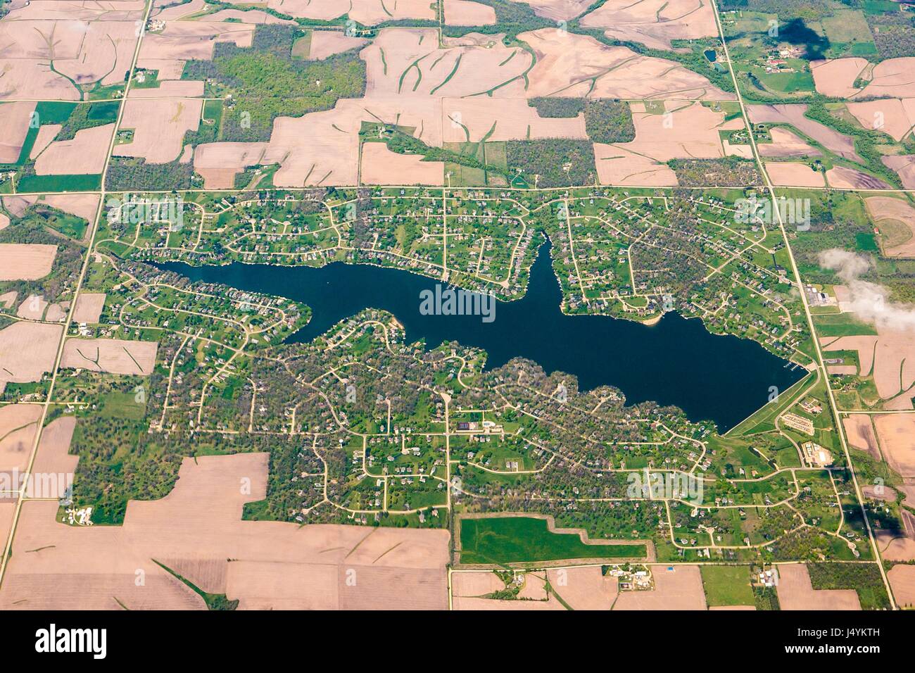 Residential development surrounded by farm fields in spring viewed from 10,000 feet May 6, 2017 in Northern Illinois. Stock Photo