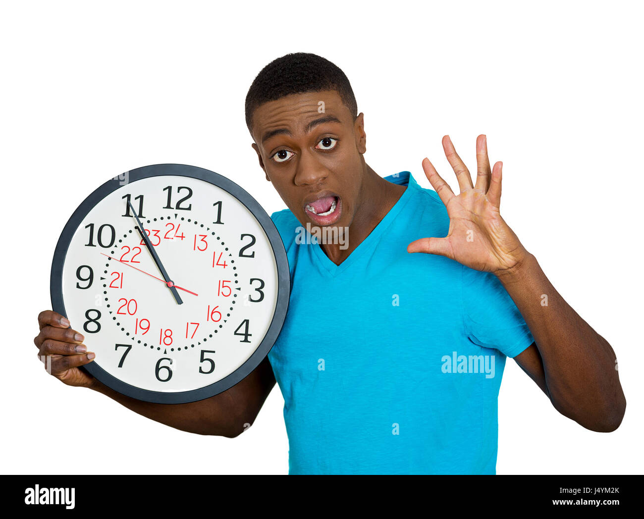 Closeup portrait funny looking man student holding wall clock, stressed