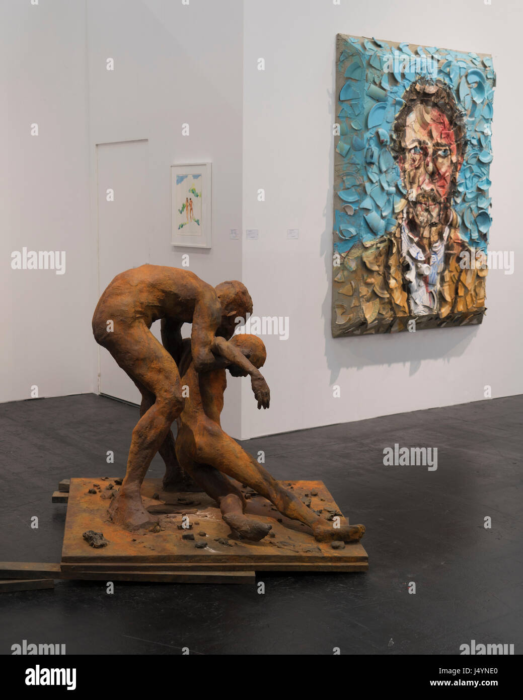 The bronze statue on the left is named 'Ten Breaths'  (2007-2008) by Eric Fischl. On the right is 'Portrait of Tonio Cacace' ( 2009) by Julian Schnabel. Stock Photo