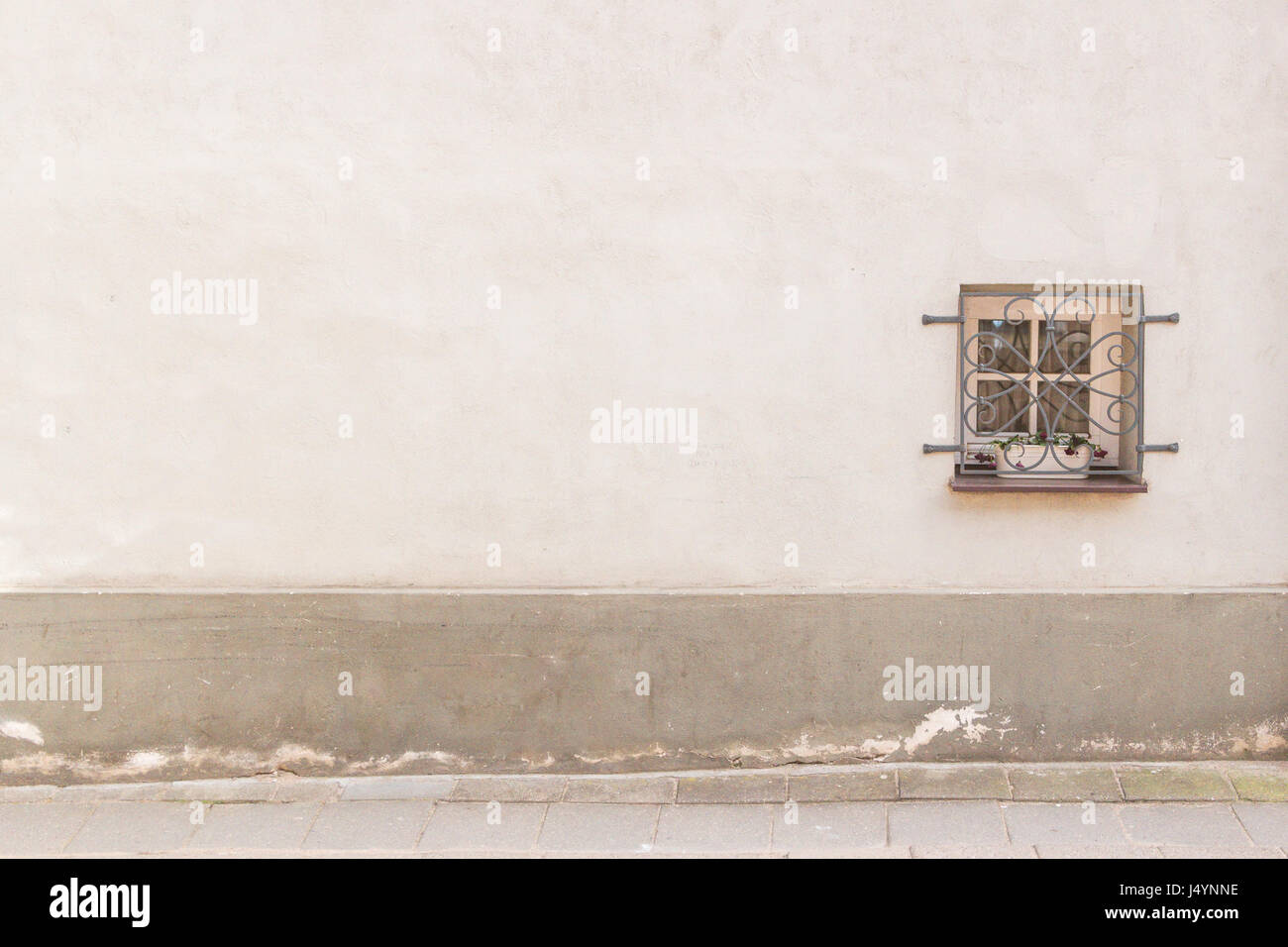 Old weathered wall with small window and a ground Stock Photo - Alamy