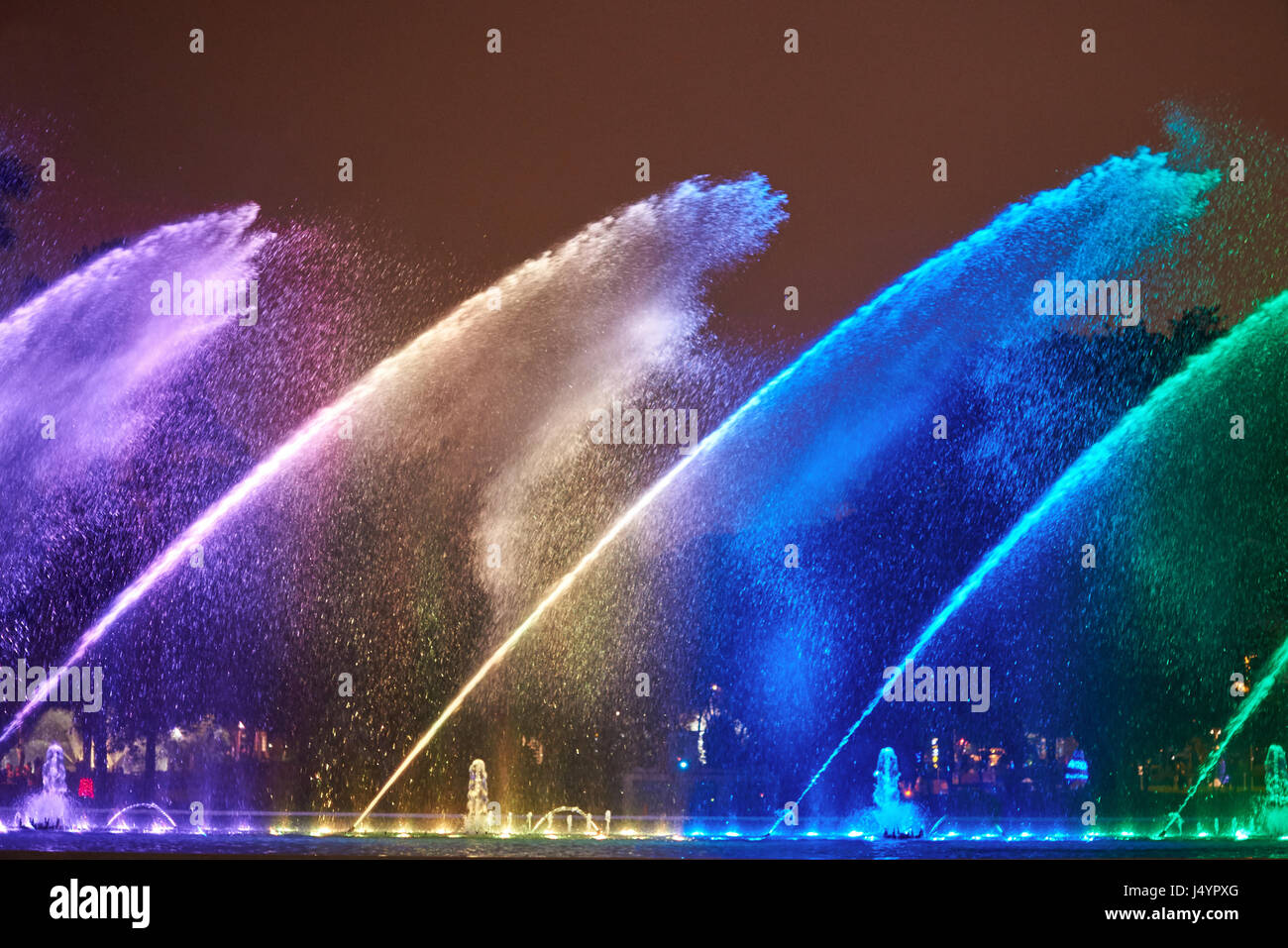 Night colorful fountain show in Lima park. Vivid color fountain water Stock Photo