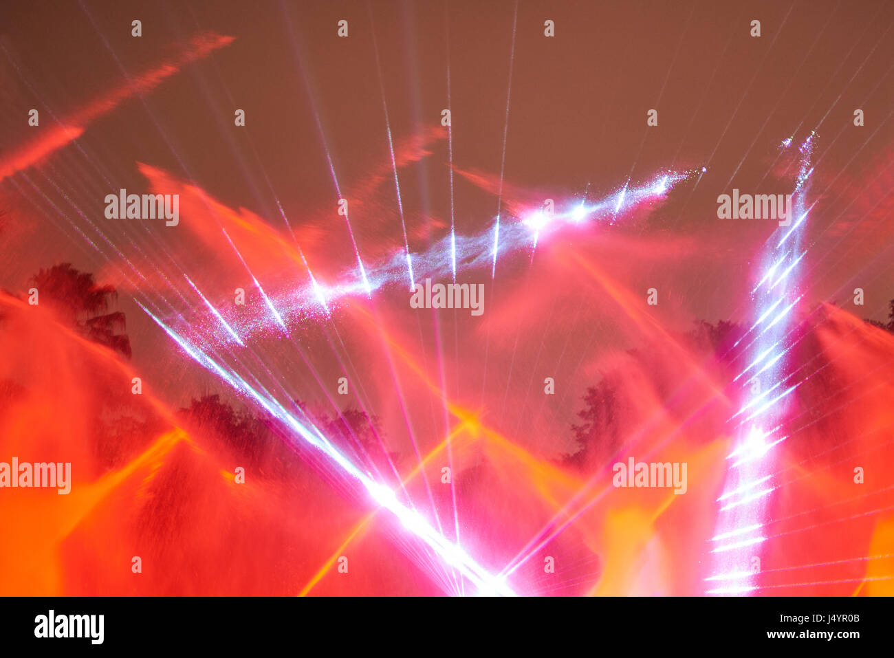 Red laser disco show. Abstract red lights from projector Stock Photo