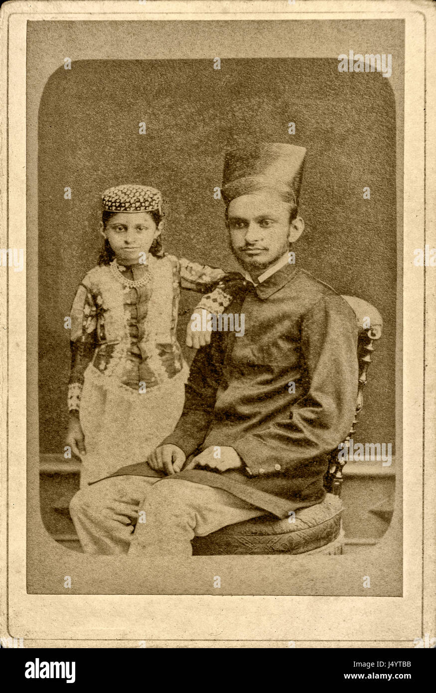 Vintage 1866 studio sepia photograph of parsi father and daughter, mumbai, maharashtra, india, asia Stock Photo