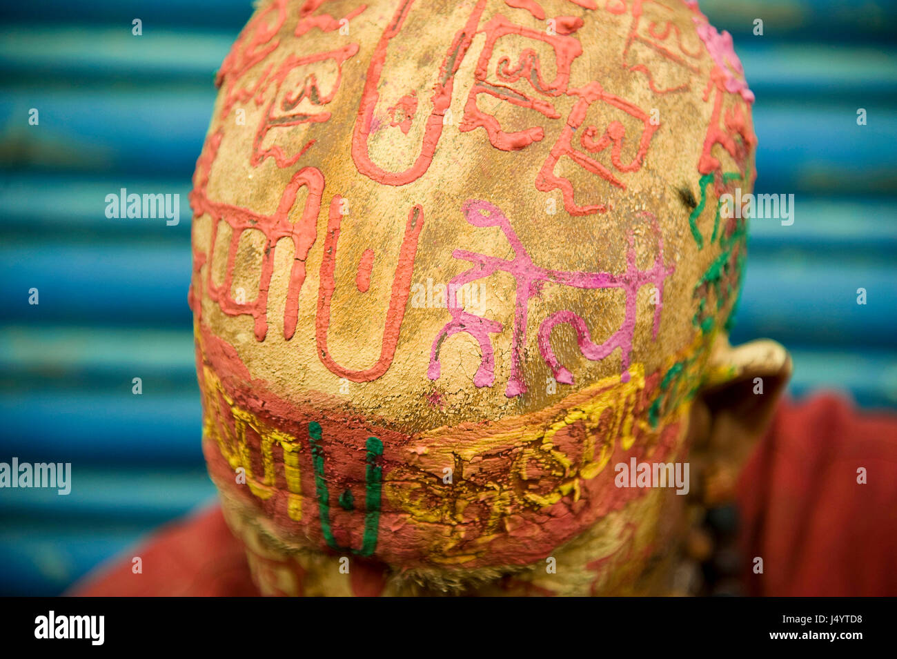 Priest writing radhe krishna on head by sandalwood paste, uttar pradesh, india, asia Stock Photo