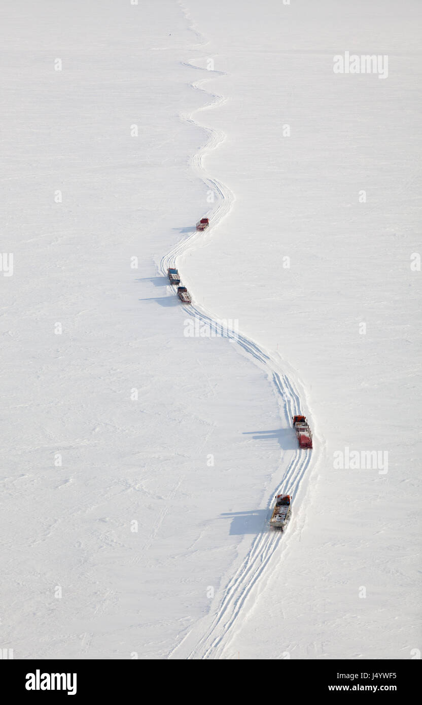 Trucks in winter tundra from above Stock Photo