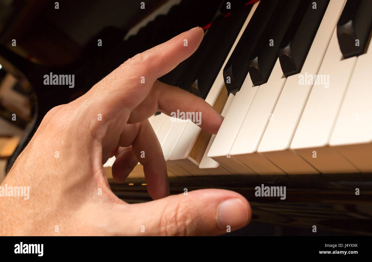 Pianist hand playing one note hi-res stock photography and images - Alamy