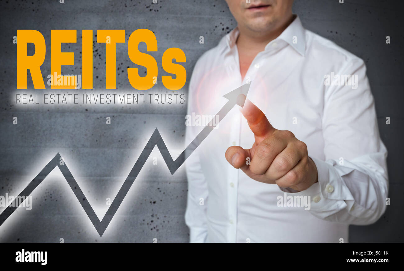 REITs touchscreen is operated by man. Stock Photo