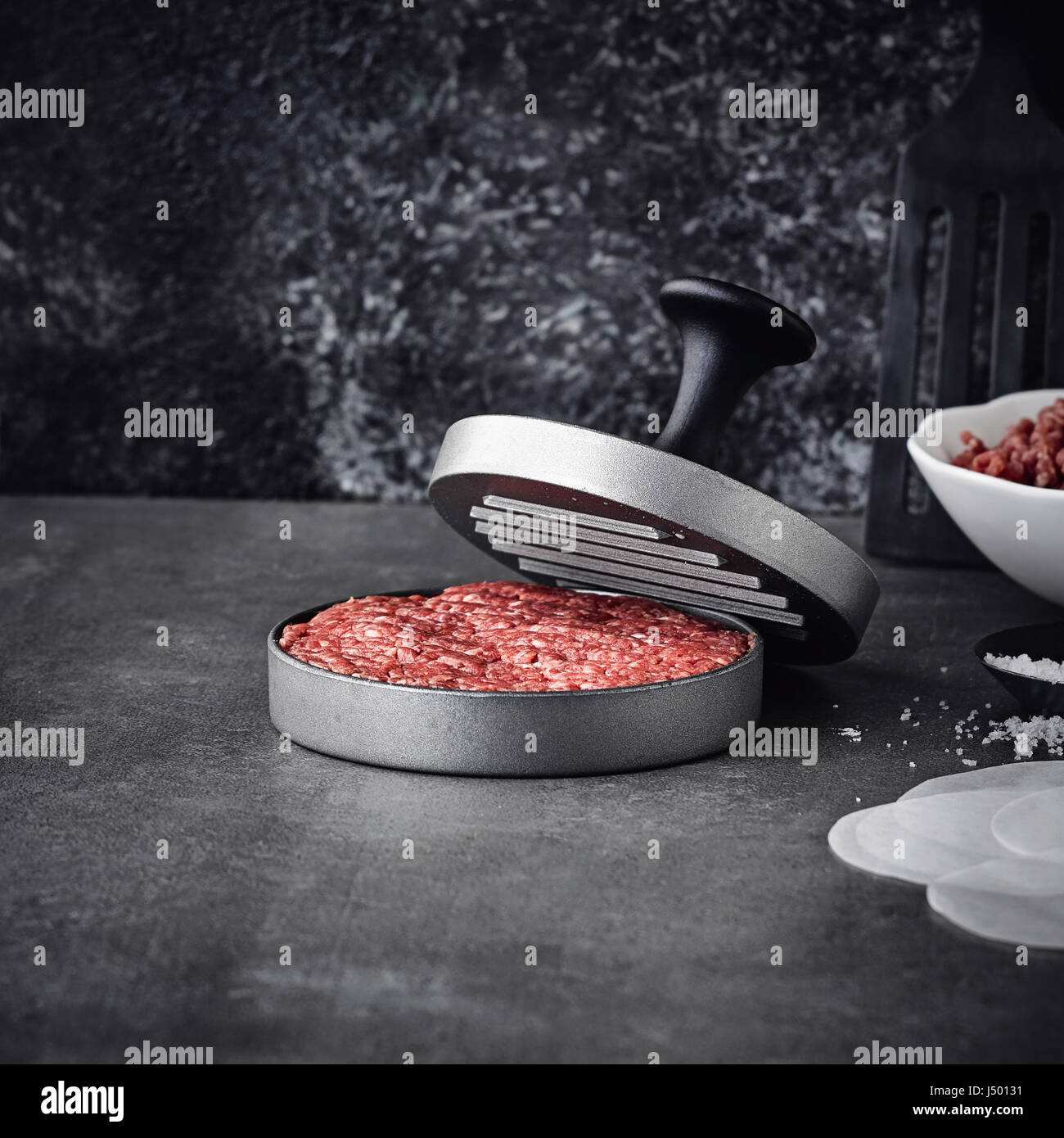 Hamburger press with freshly pressed burger patty Stock Photo