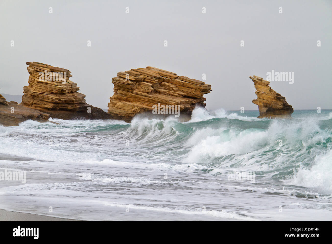 Triopetra, cliffs of platy sandstone on Crete, Greece Stock Photo