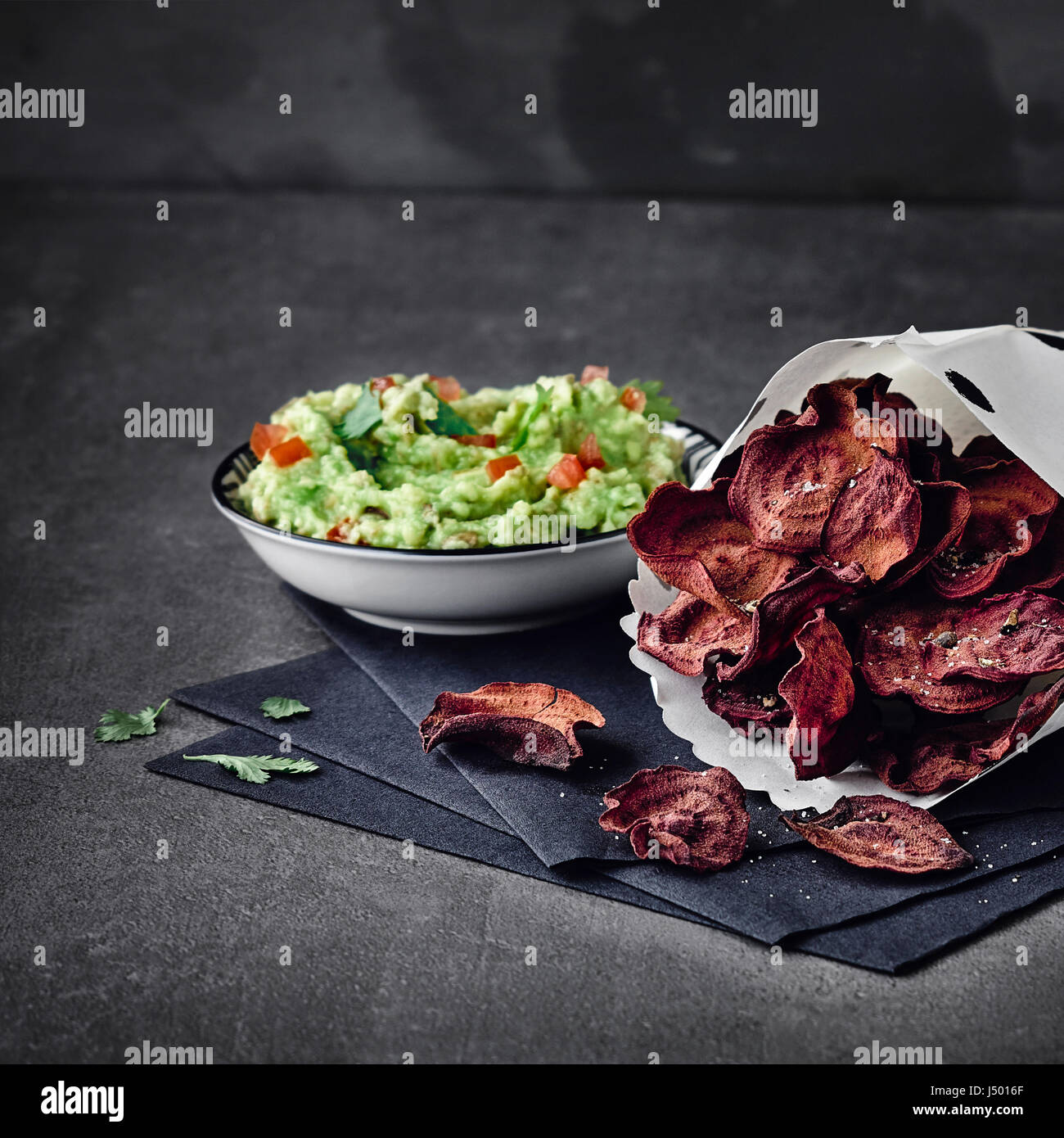 Beetroot chips with guacamole Stock Photo