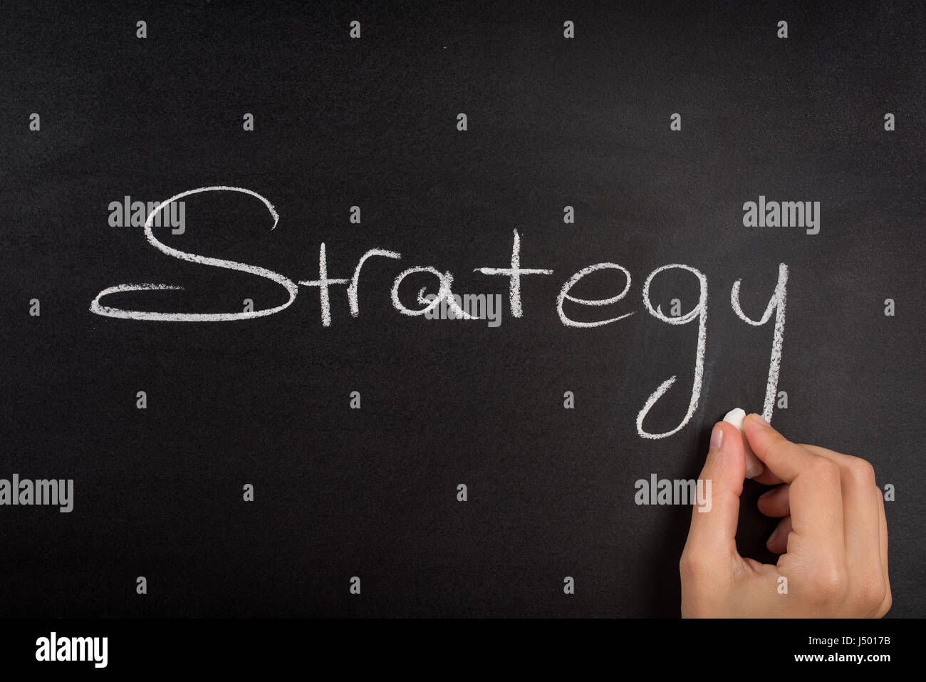 Close up of business strategy word on blackboard. Stock Photo