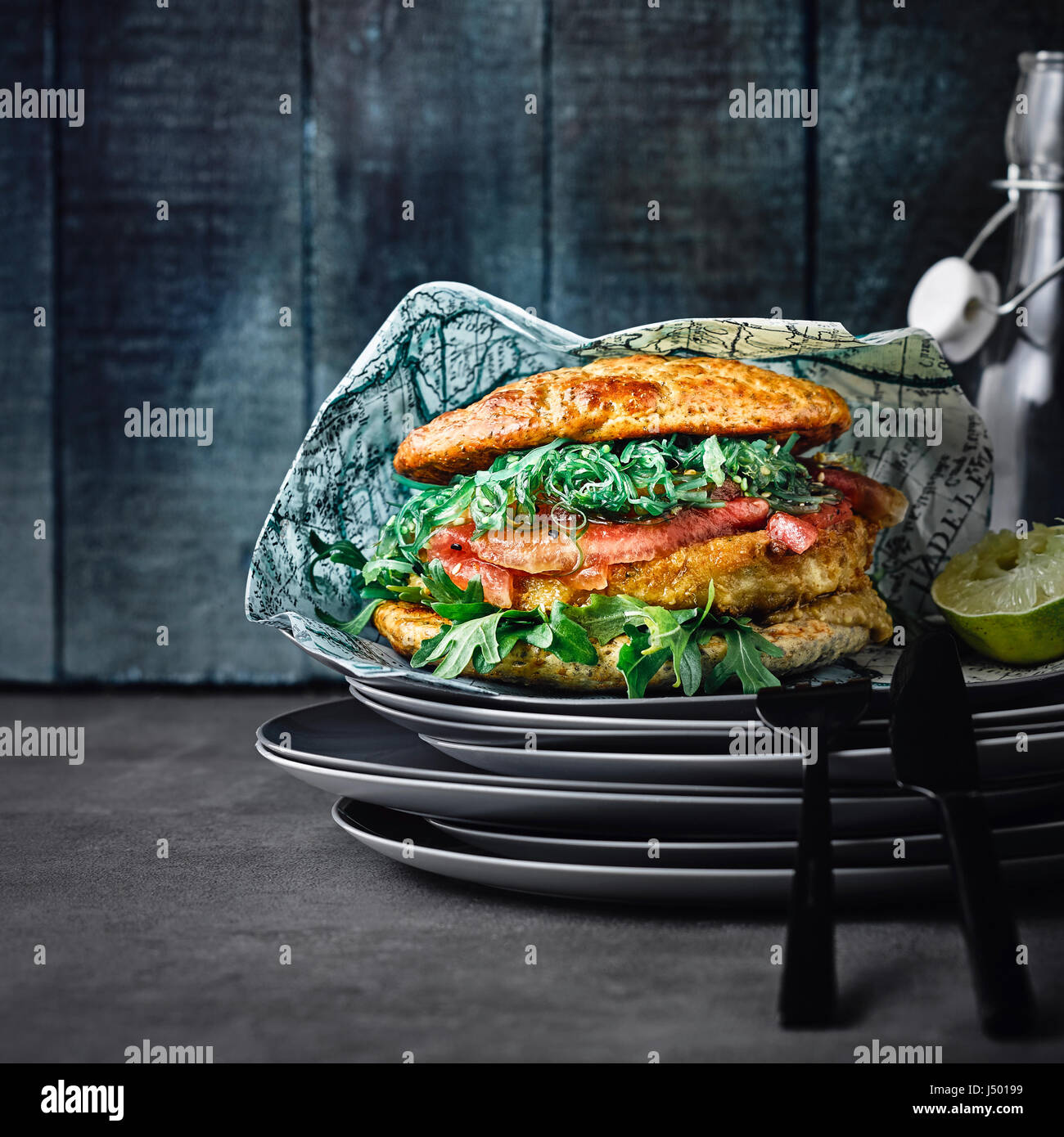 Fish burger with watermelon and wakame salad Stock Photo