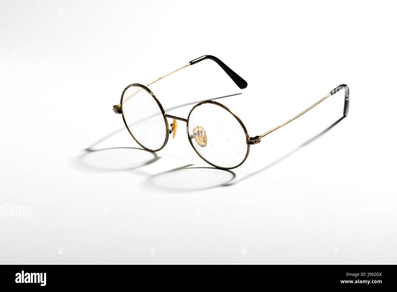 Pair of old vintage spectacles with wire frames and round lenses ...