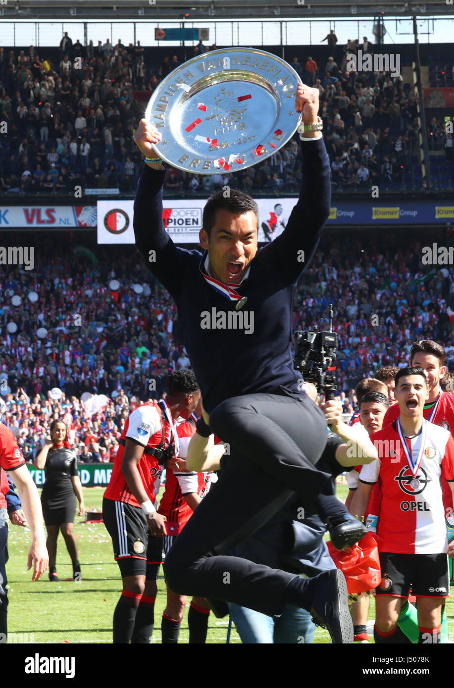 Rotterdam, Netherlands. 14th May, 2017. Feyenoord Rotterdam's headcoach Giovanni van Bronckhorst celebrates during the awarding ceremony after the Dutch Eredivisie match between Feyenoord Rotterdam and Heracles Almelo in Rotterdam, the Netherlands, May 14, 2017. Credit: Gong Bing/Xinhua/Alamy Live News Stock Photo