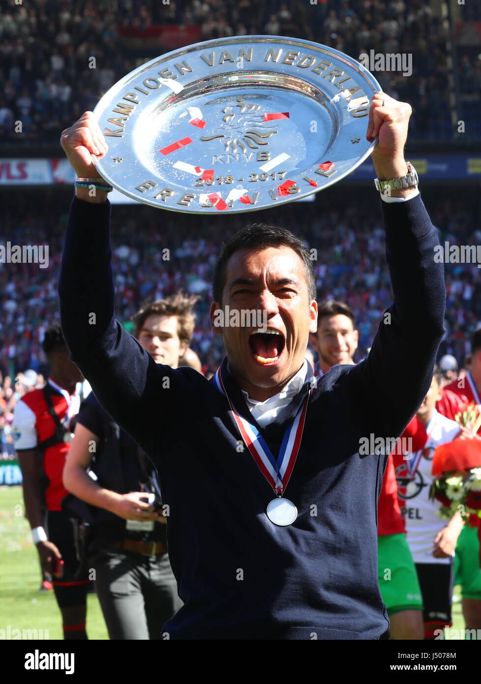 Rotterdam, Netherlands. 14th May, 2017. Feyenoord Rotterdam's headcoach Giovanni van Bronckhorst celebrates during the awarding ceremony after the Dutch Eredivisie match between Feyenoord Rotterdam and Heracles Almelo in Rotterdam, the Netherlands, May 14, 2017. Credit: Gong Bing/Xinhua/Alamy Live News Stock Photo