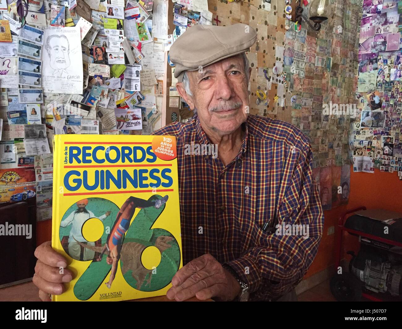Merida, Venezuela. 6th Apr, 2017. Ice cream shop owner Manuel da Silva Oliveira holds up a Guiness Book of Records from 1996, in which he is mentioned for selling 593 types of ice cream at his shop in Merida, Venezuela, 6 April 2017. Today, he sells roughly 870 types of ice cream and holds the world record. Photo: Georg Ismar/dpa/Alamy Live News Stock Photo