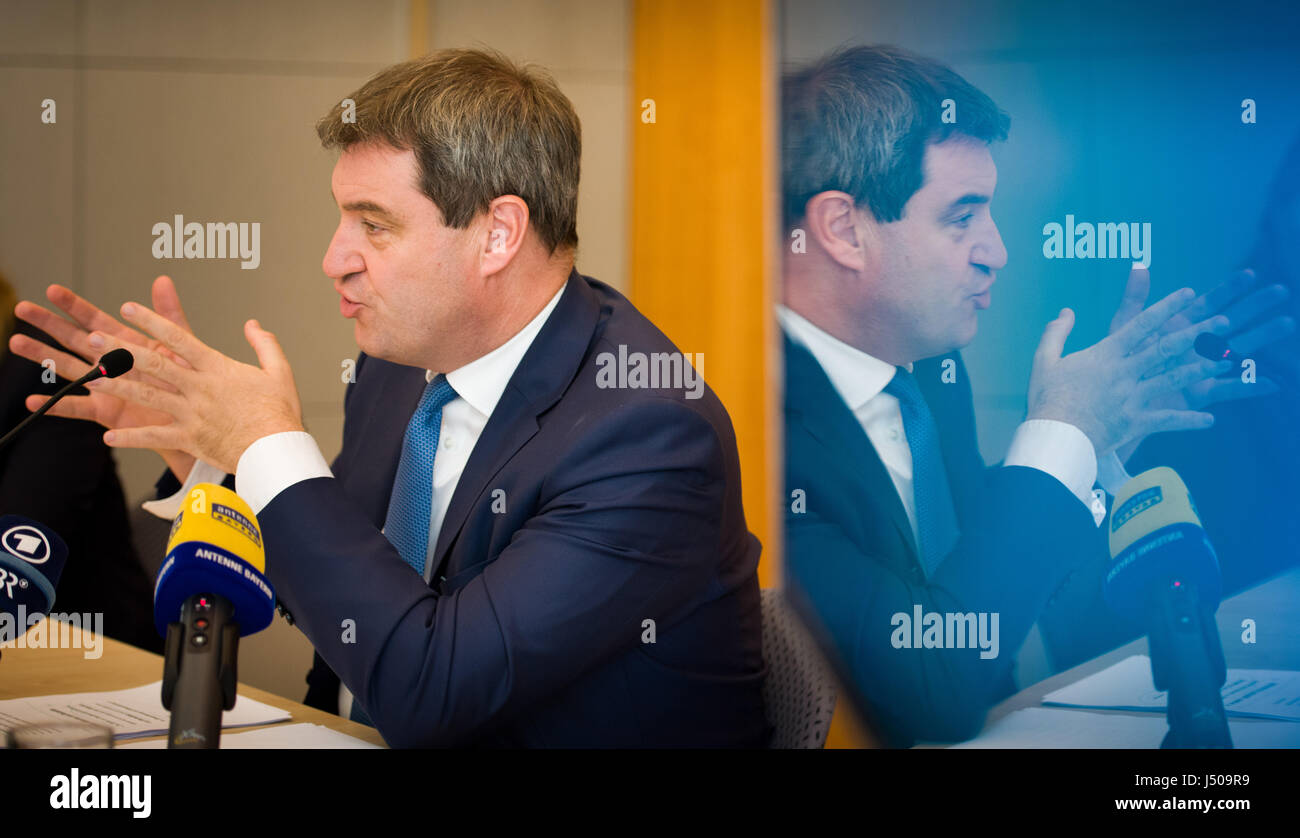 The Bavarian minister for finance and homeland, Markus Soeder speaks with big hand gestures druing the presentation of the homeland reports 2016. Photo: Florian Eckl/dpa Stock Photo