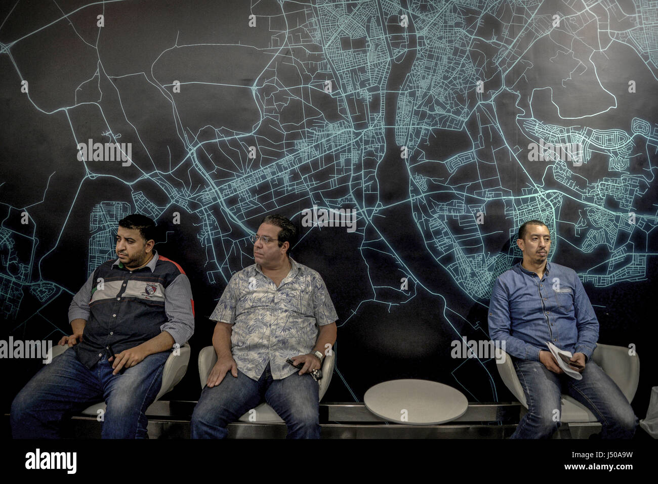 Cairo, Egypt. 11th May, 2017. Uber drivers sit in a service and