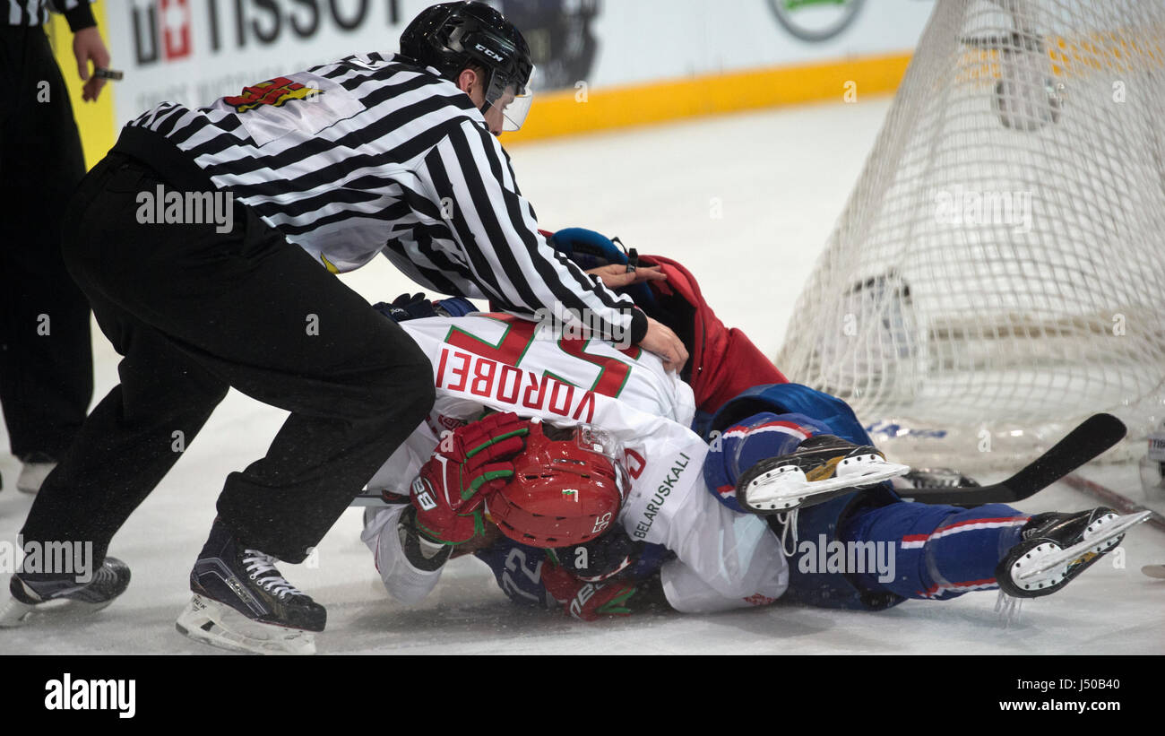 Paris, France. 12th May, 2017. L-R PAVEL VOROBEJ of Belarus and French  hockey player JORDANN PERRET in action during the Ice Hockey World  Championships match France vs Belarus in Paris, France, on