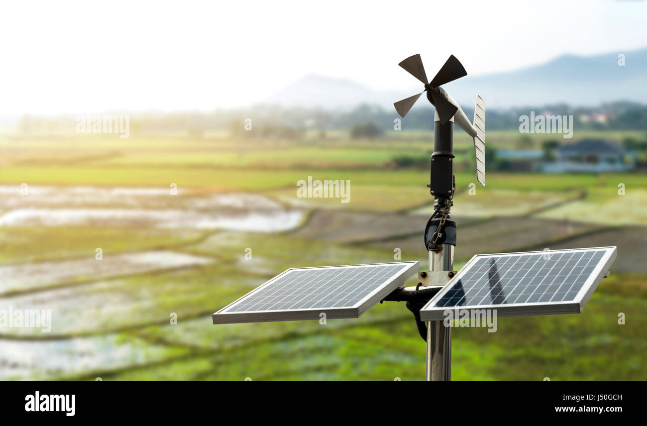 Smart agriculture and smart farm technology concept. Revolving vane anemometer, a meteorological instrument used to measure the wind speed and solar c Stock Photo