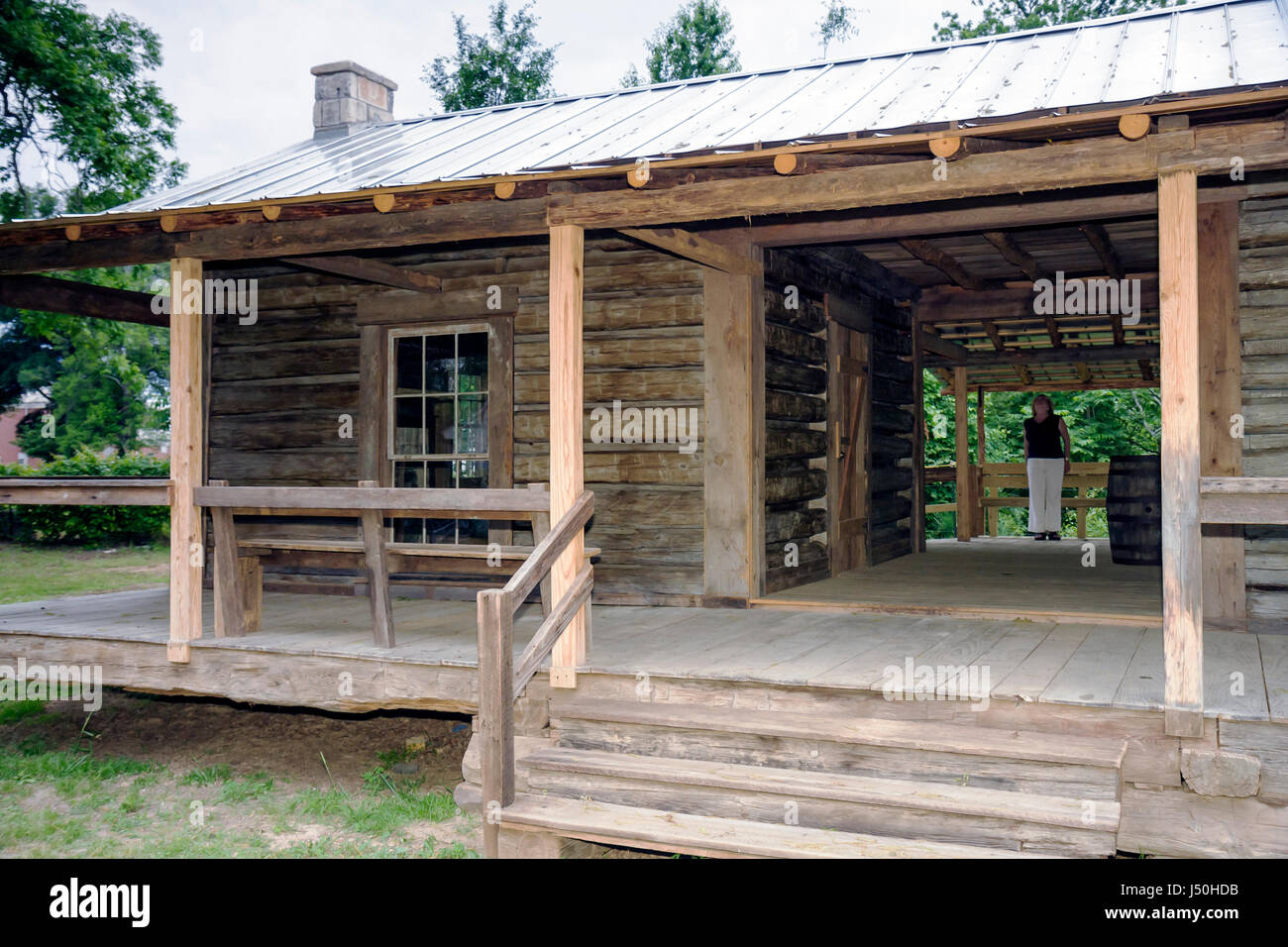 Alabama,Grove Hill,historical Museum of Clarke County,dog trot house,houses,woman female women,vernacular architecture,wood frame,rural,Mathews cabin, Stock Photo