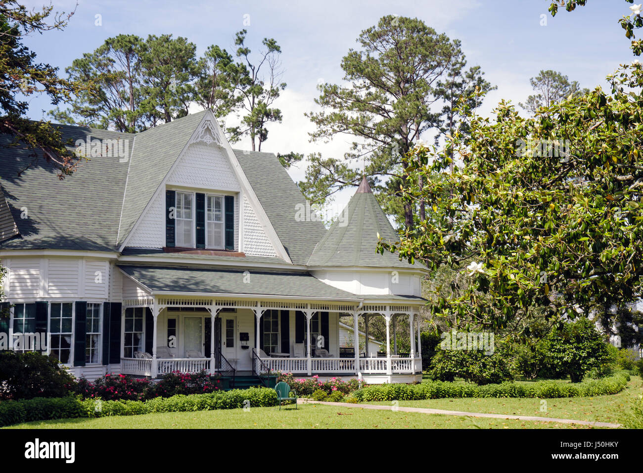 Monroeville Alabama,Pineville Road,historic homes,Stallworth home,Queen Anne style,columns,wrap around porch,turret,gabled roof,front yard,tree,landsc Stock Photo