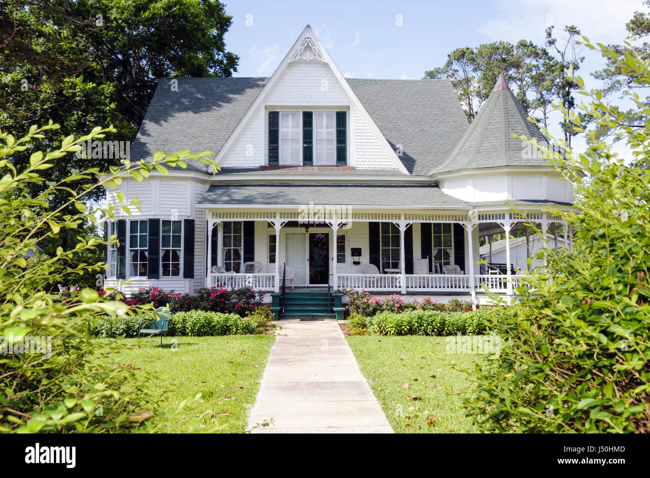 Monroeville Alabama,Pineville Road,historic homes,Stallworth home,Queen Anne,columns,wraparound porch,turret,gabled roof,front yard,tree,street,sidewa Stock Photo