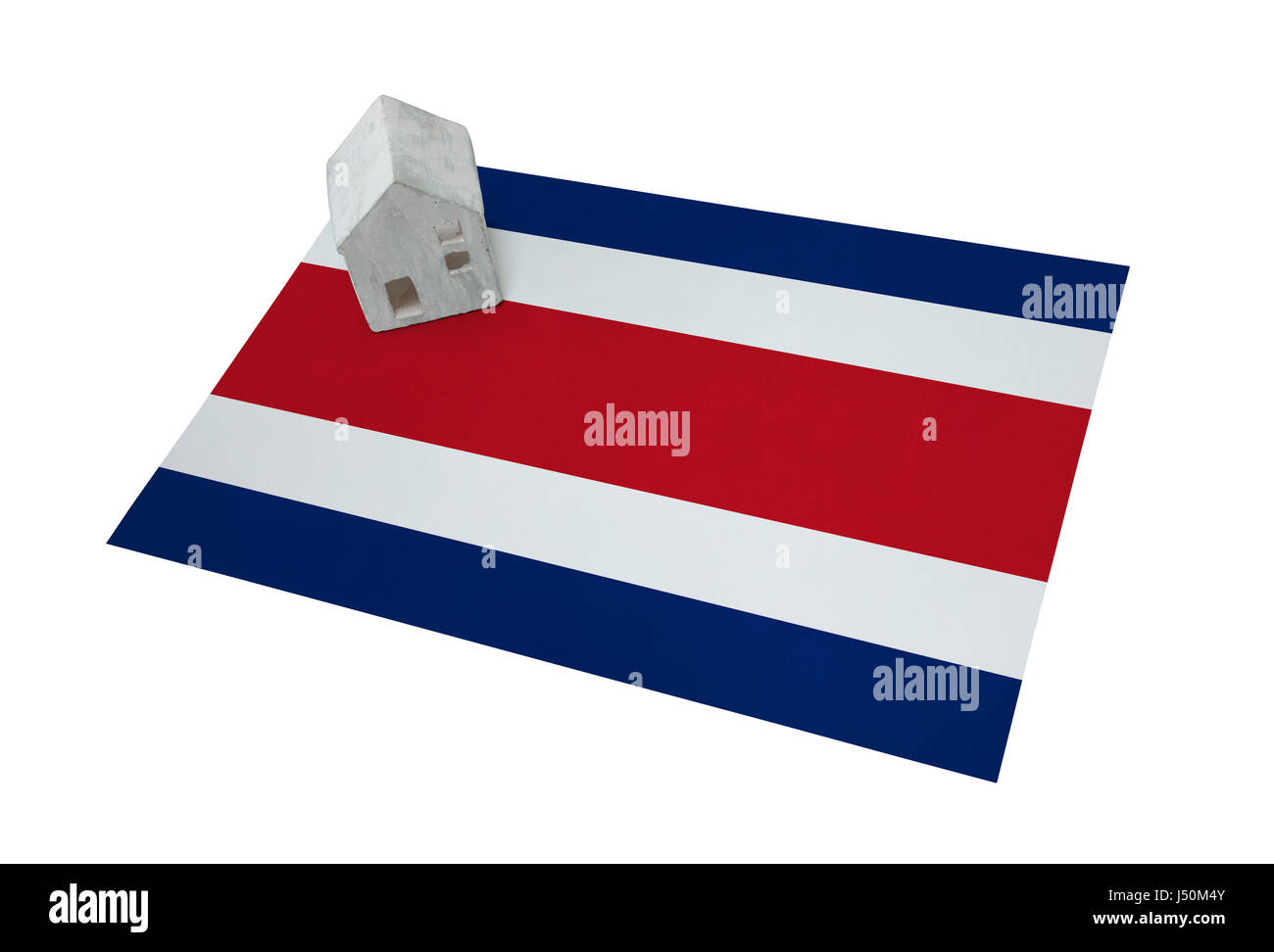 Small house on a flag - Living or migrating to Costa Rica Stock Photo
