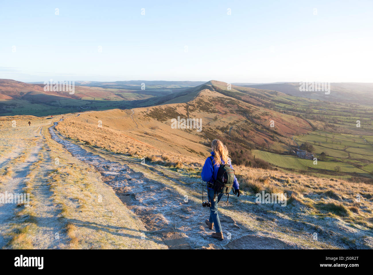 A walker on the Mam Tor ridge at sunrise Stock Photo - Alamy