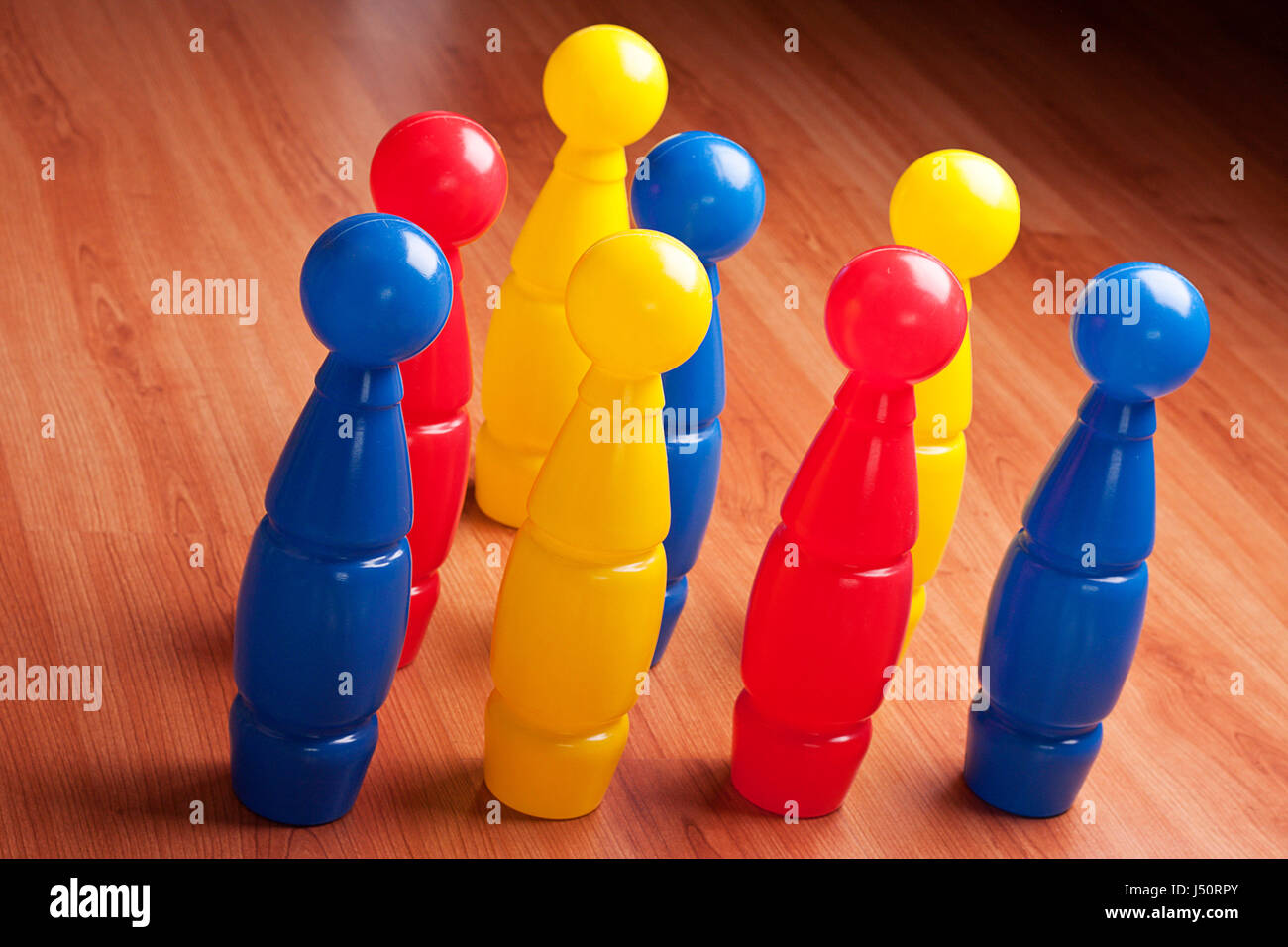 colour Bowling pins on hardwood floor Stock Photo Alamy