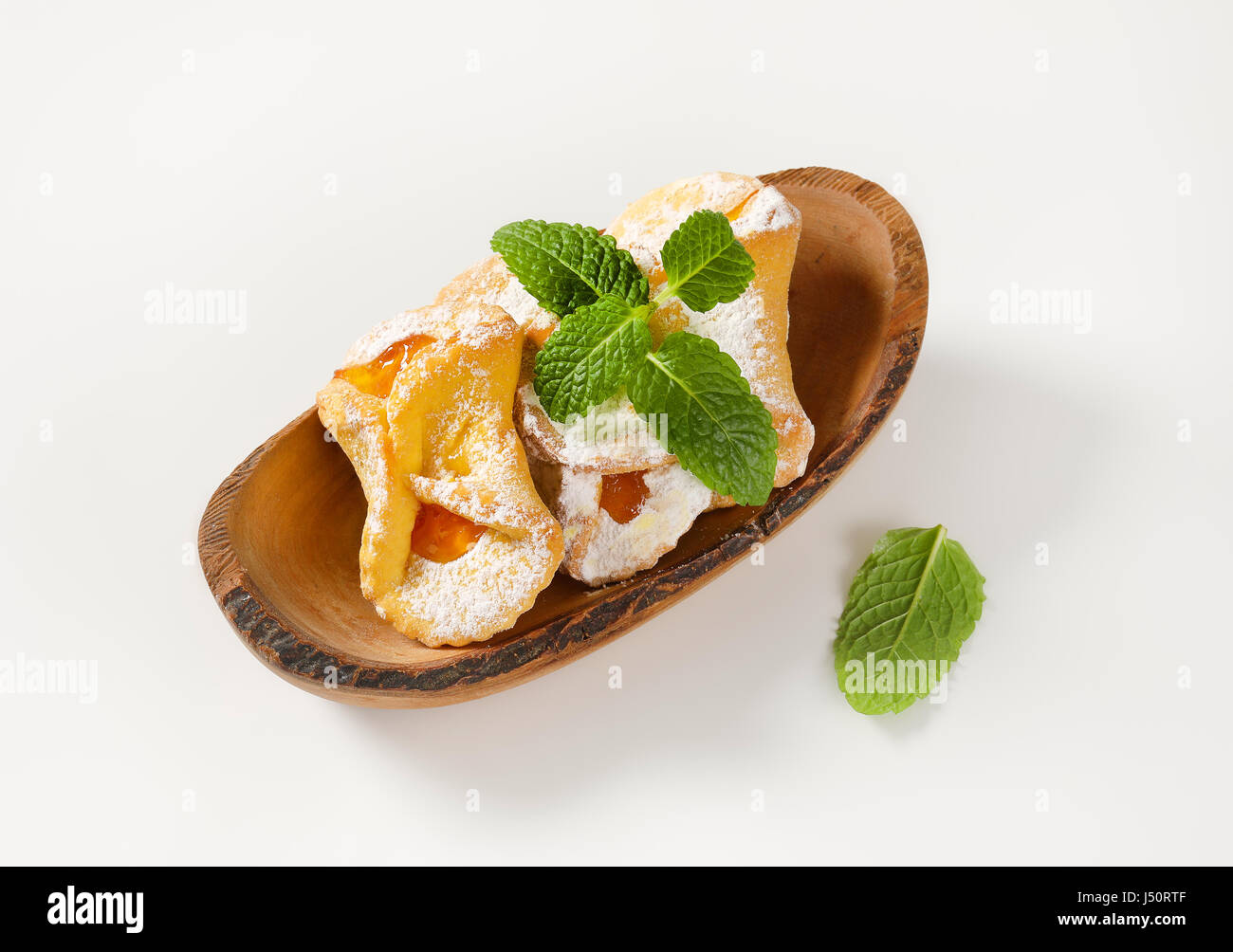 bowl of tea cakes with apricot jam filling on white background Stock Photo Alamy
