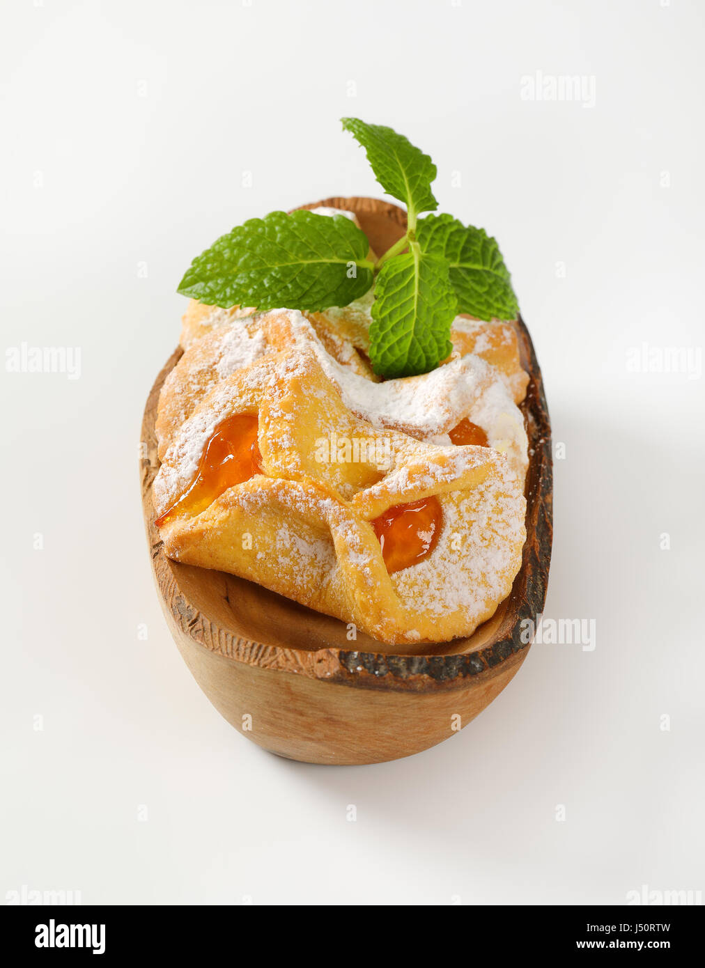 bowl of tea cakes with apricot jam filling on white background Stock Photo Alamy