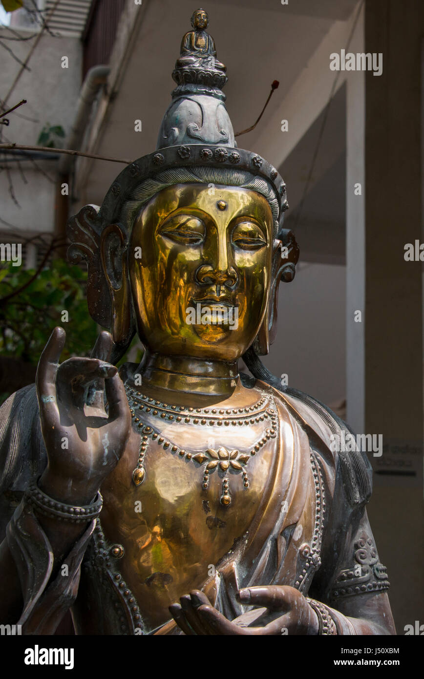 Sri Lanka, Colombo, Buddhist Temple. Detail of brass Sri Lankan artwork