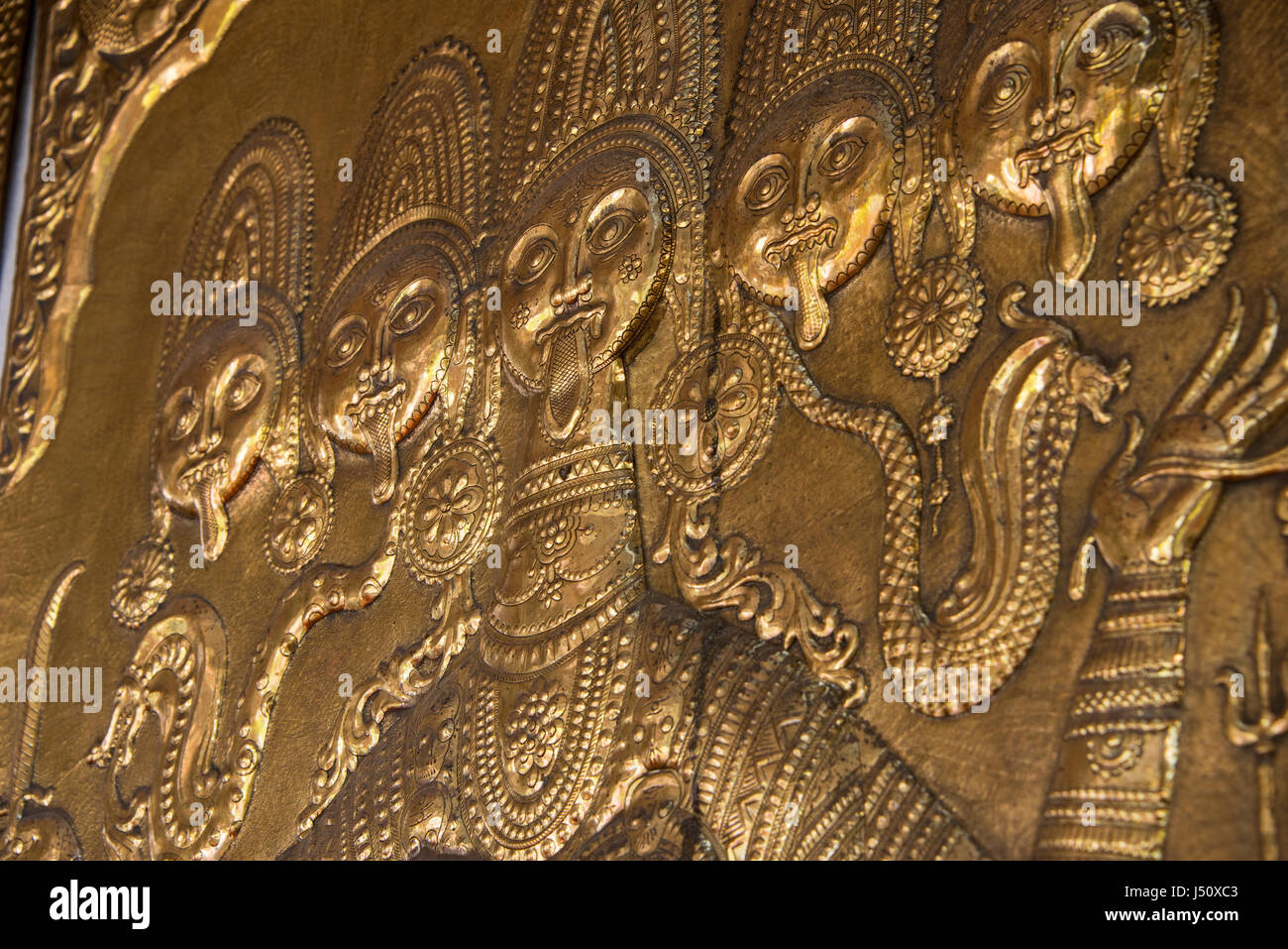 Sri Lanka, Colombo, Buddhist Temple. Detail of brass Sri Lankan artwork