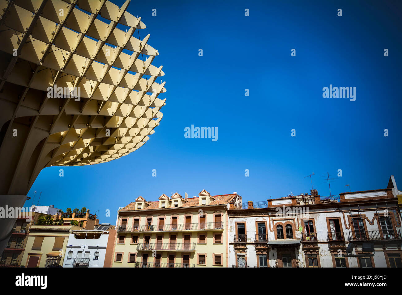 Wooden Metropol Parasol with Seville buildings and sky Stock Photo