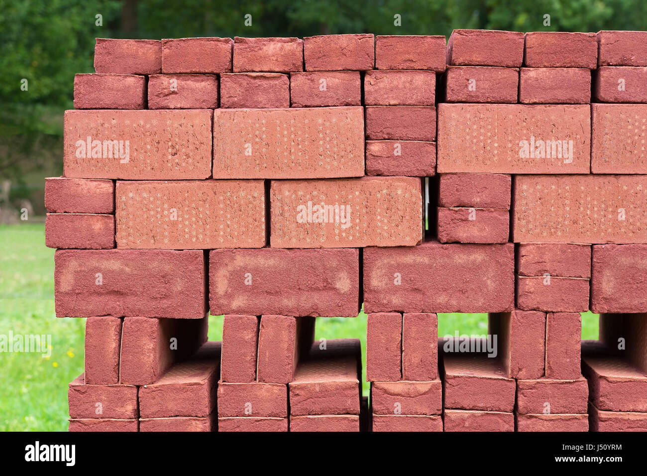 Pile of stacked red bricks outdoors Stock Photo Alamy
