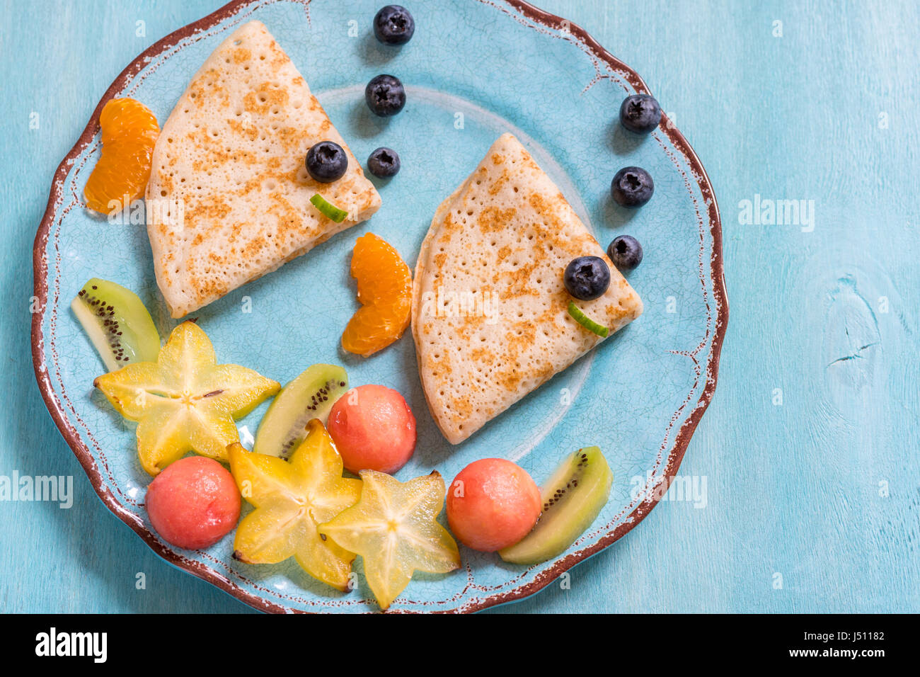 Funny crepes pancakes looks like a fish Stock Photo Alamy