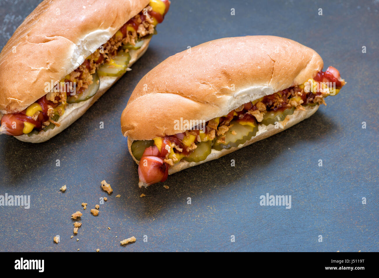 Grilled hot dogs with mustard, ketchup and dill pickles Stock Photo Alamy