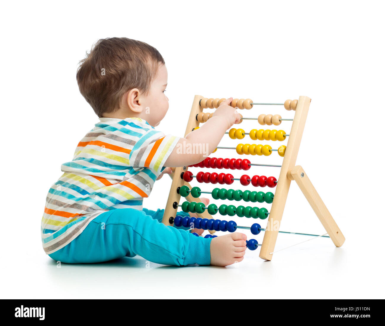 Baby playing with abacus. Isolated on white background Stock Photo
