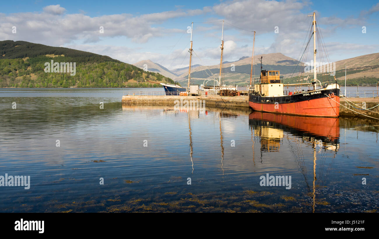Inveraray, Scotland - May 13, 2016: The Vital Spark, a famous 'Clyde Puffer' boat, is moored at Inveraray Pier in Loch Fyne in the West Highlands of S Stock Photo