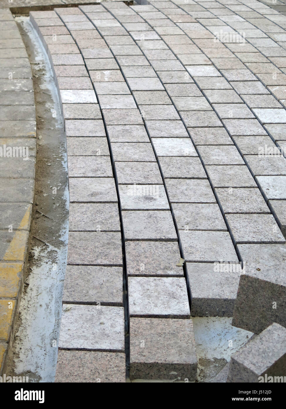 Square paving stones awaiting grouting in village street in Andalusia Stock Photo